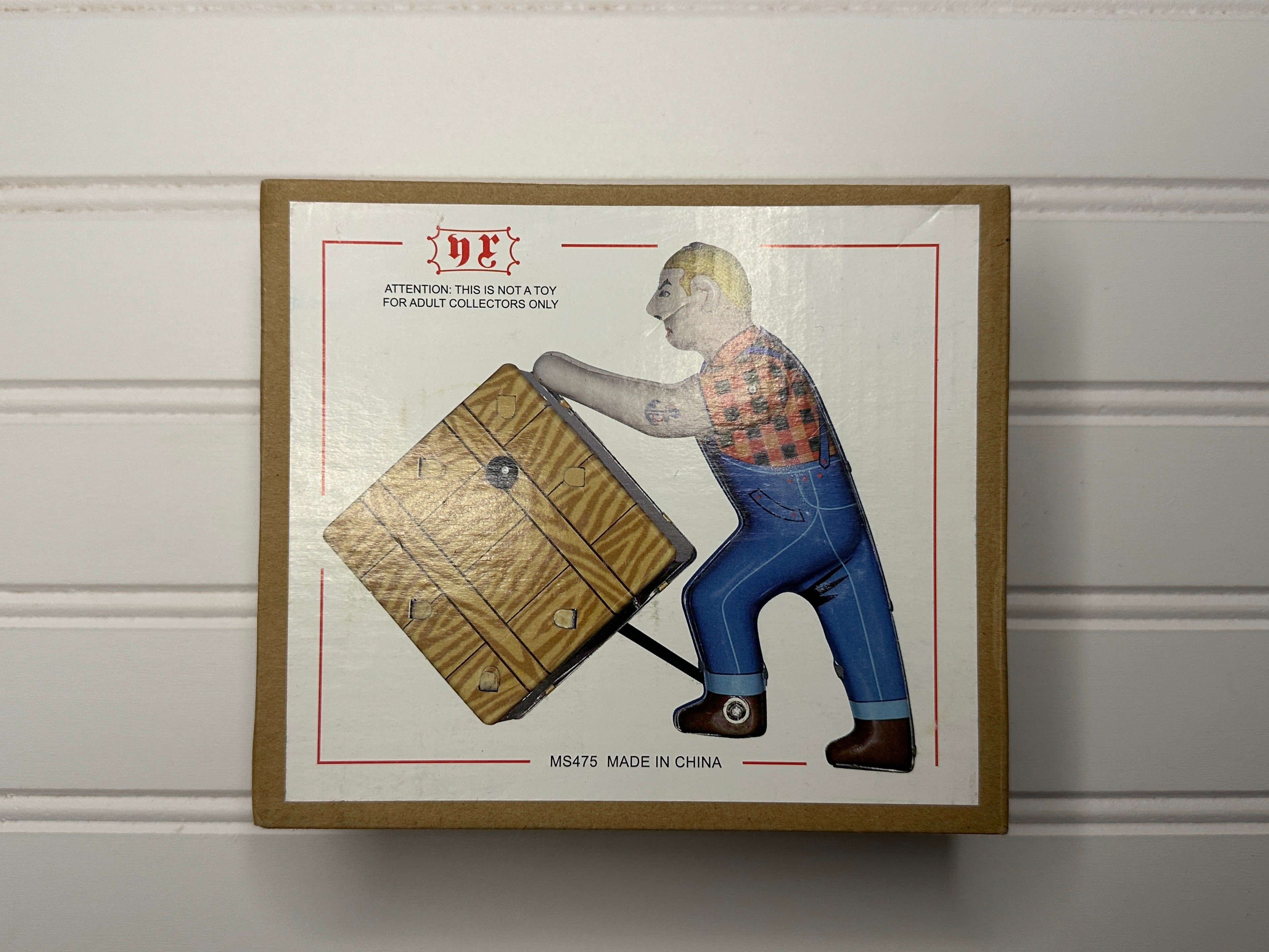 Man Pushing a Box Vintage Tin Toy