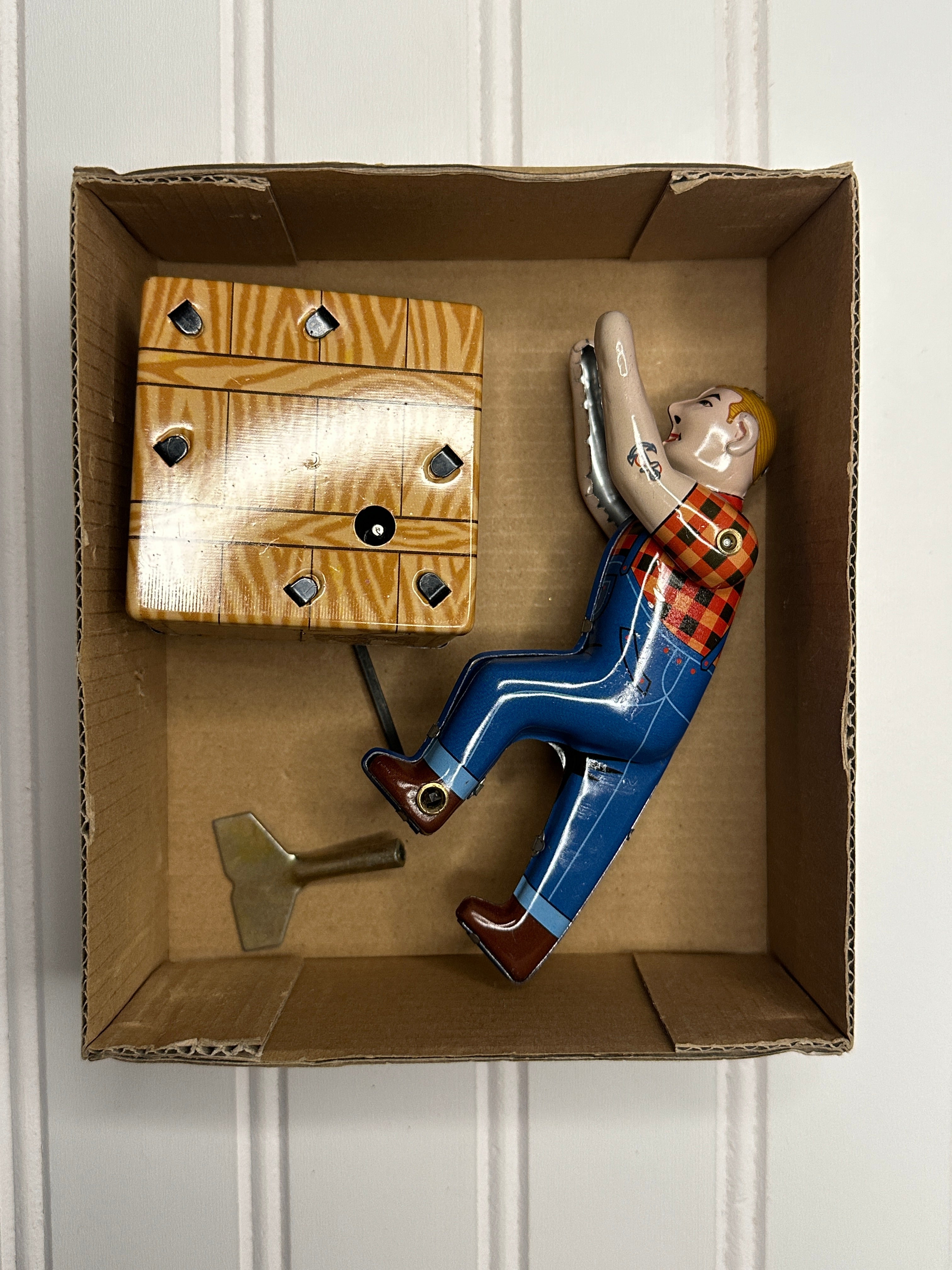 Man Pushing a Box Vintage Tin Toy