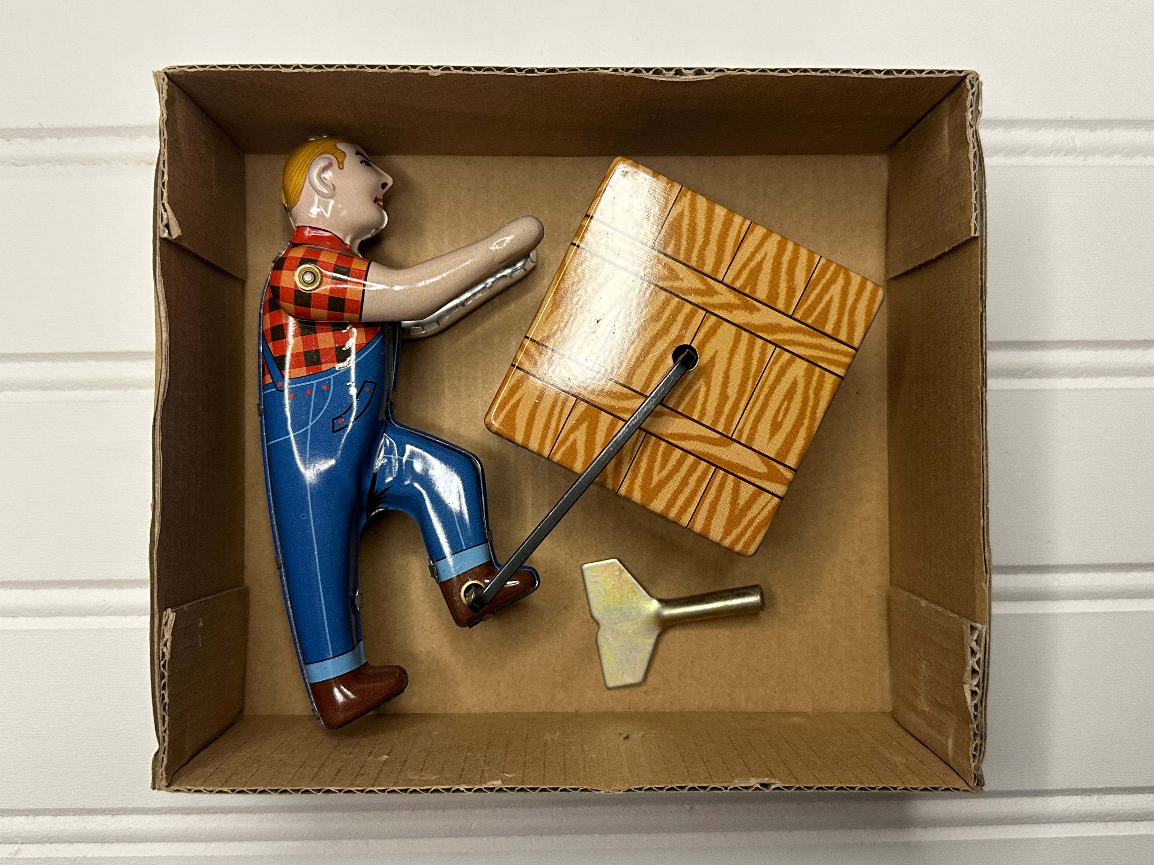 Man Pushing a Box Vintage Tin Toy